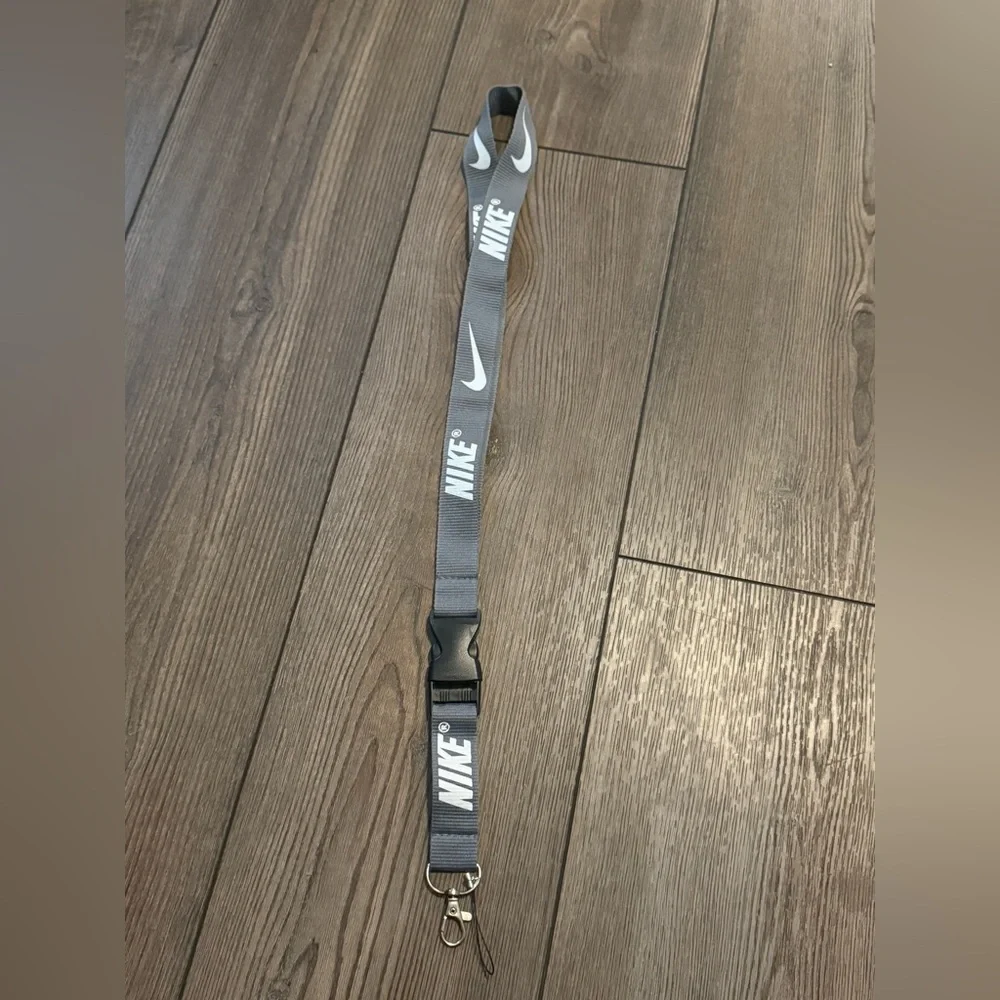 Gray Nike Lanyard with White Letters